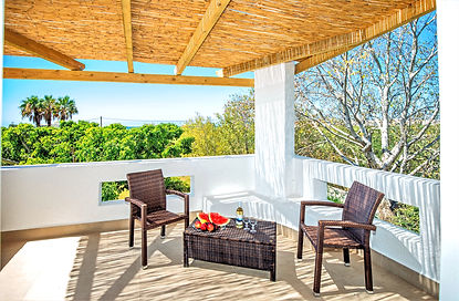 Private pergola-shaded veranda in the Master Suite, offering a secluded "secret escape" hidden within the lush Mediterranean tree canopy.