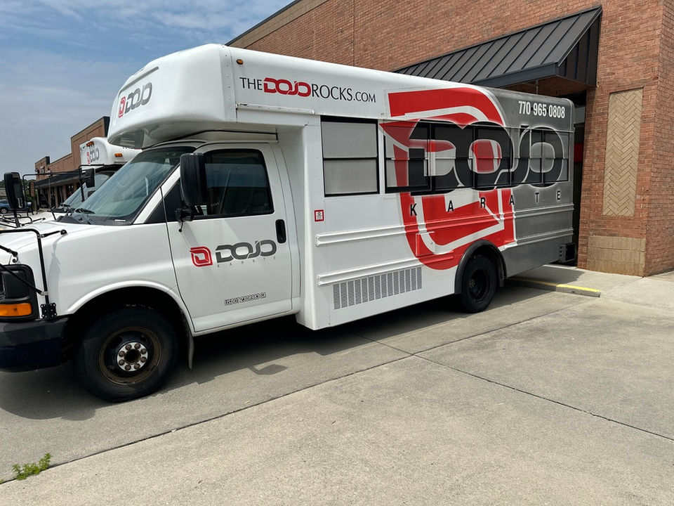 Karate transportation parked outside martial arts gym