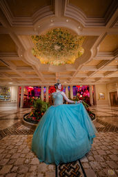 Bellagio Las Vegas quinceañera portrait with turquoise gown and elegant interior.