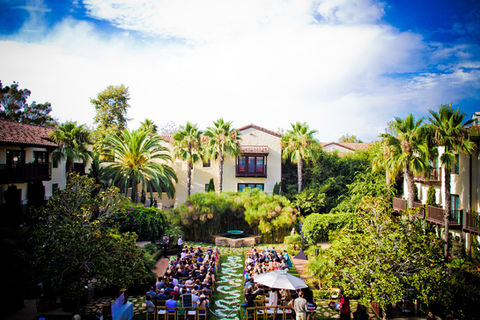 Estancia La Jolla Wedding ceremony setup with guests and venue under a blue sky.
