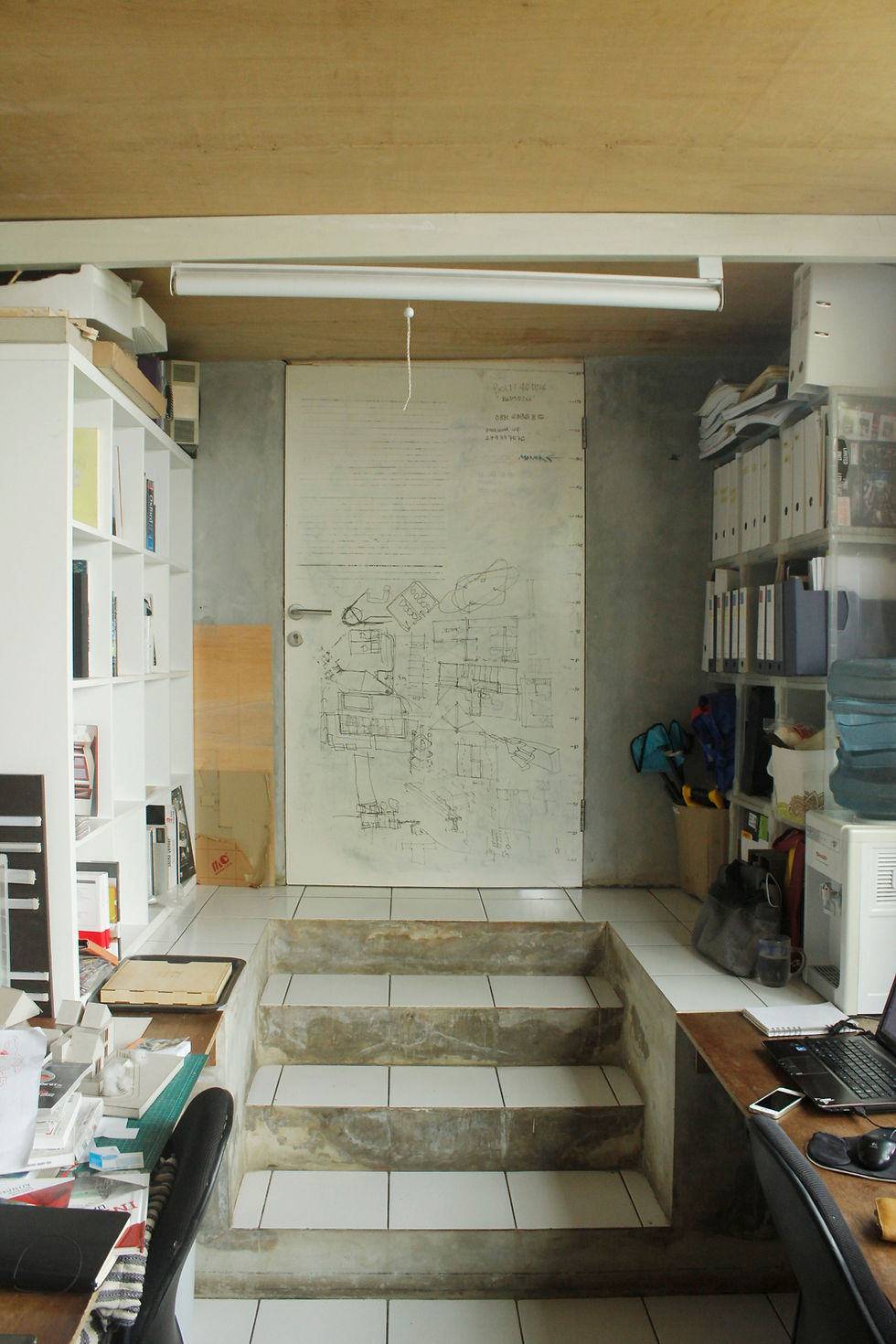 whiteboard at the back of the door