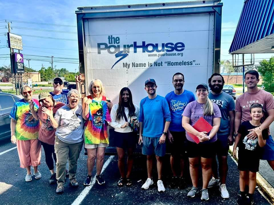 Black Hat Society of Irvington Members assisting with a PourHouse move-in day.