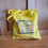 Thumbnail: Yellow "Endo Is" tote bag on a wood bench