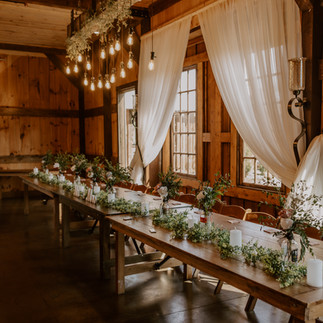 A spring wedding at Roca Pioneer Barn in Lincoln, Nebraska, captured by Wallace + Sage Photography. This gallery features romantic bride and groom portraits in golden fields, editorial-style bridal fashion with a cathedral-length double skirt, a joyful bubble entrance, and a wedding party stop at the iconic Roca Tavern barn . Perfect inspiration for couples planning a Nebraska barn wedding with elevated details and personal flair.