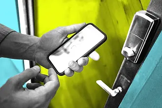 professional door buzzer technician repairing Brooklyn door