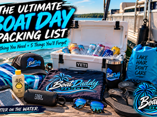 BoatDaddy Designs ultimate boat day packing list featuring a cooler, sunscreen, towels, sunglasses, dry bag, portable speaker, phone case and BoatDaddy gear on a lakeside dock beside a pontoon boat.
