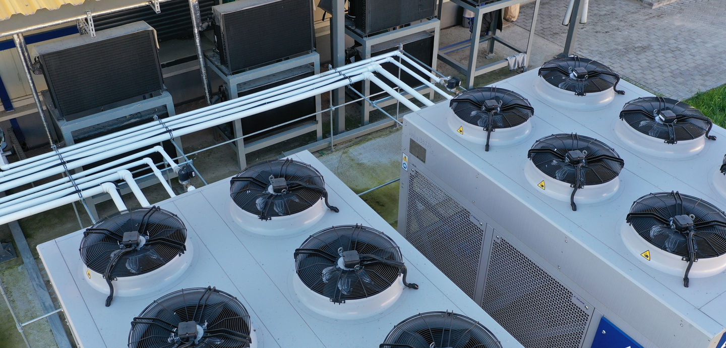 A complex of powerful fans for air purification at a dairy farm. The smell of manure from livestock. Industrial fans. Fans for agriculture