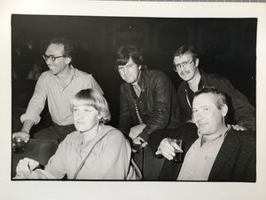Five people seated posing for photo.