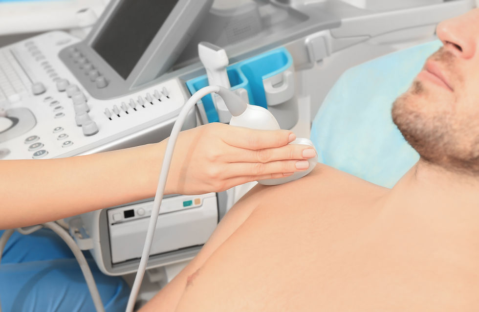 Doctor conducting ultrasound examination of patient's shoulder in clinic.jpg