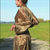 Thumbnail: girl showing how to tie shiny flowery silk dress
