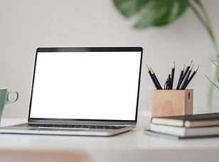 macbook-pro-on-white-table-3787903.jpg
