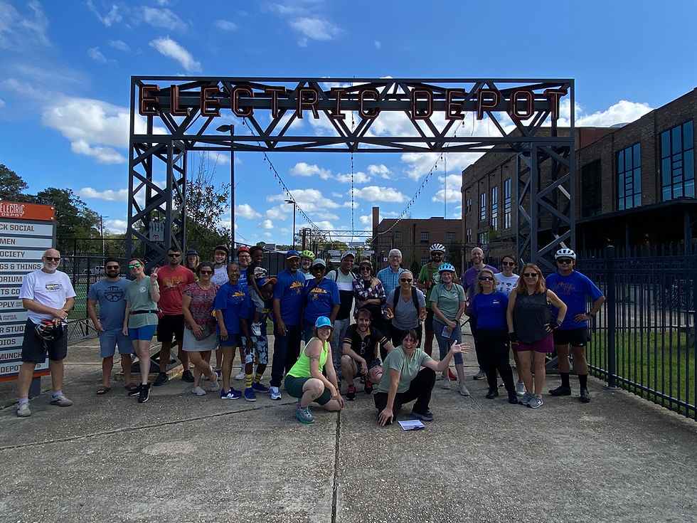 Group picture taken outside the Electric Depot. 