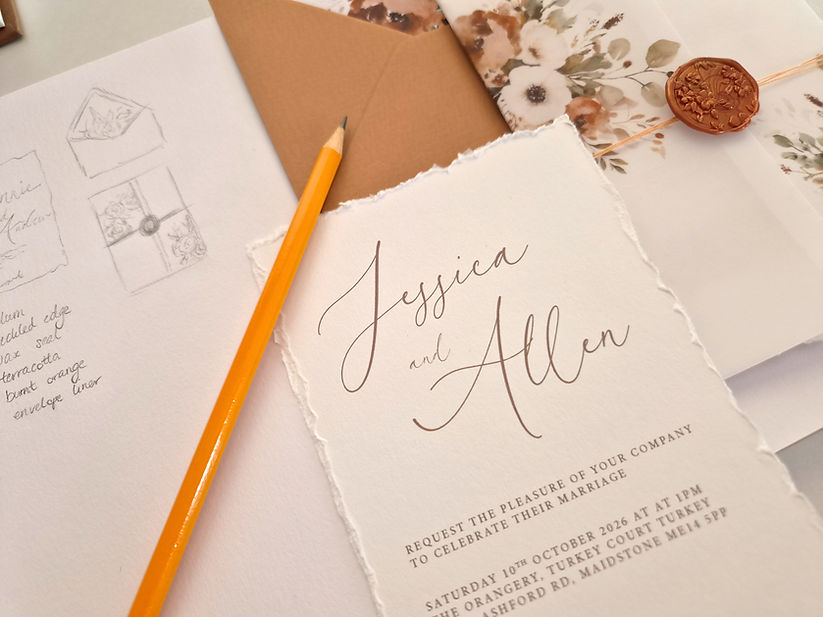 Deckled edge wedding invitation with pencil and sketch book