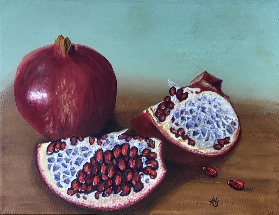 Pomegranates bursting forth with juicy seeds are open and on a table ready to eat