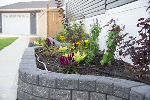 raised retaining wall with flower bed