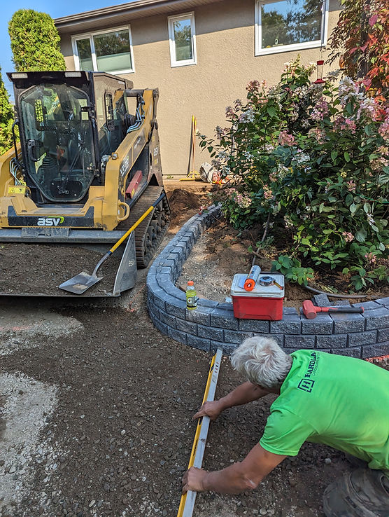 The Hardland Landscape crew landscaping and hardscaping a yard in Thunder Bay
