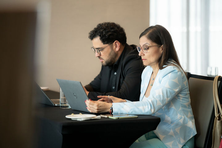 Business event coverage with networking and branding moments