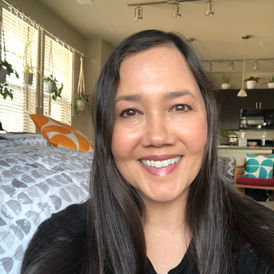 Smiling woman with long dark hair