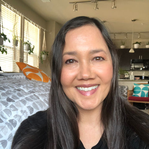 Smiling woman with long dark hair