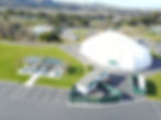 Aerial view of Monterey Zoo: picnic area and large white tent/event space