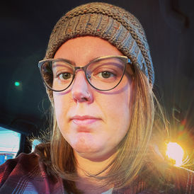 Woman in glasses and beanie