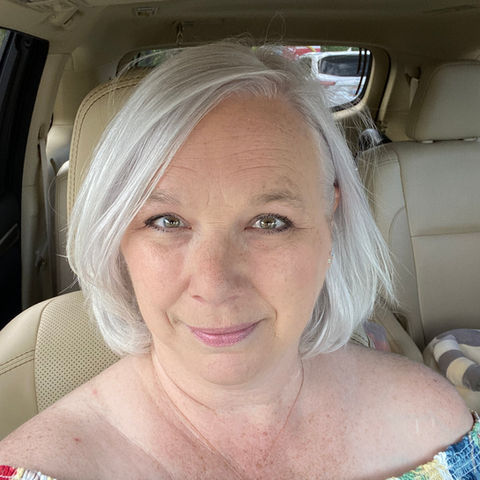 Headshot of woman with short, gray hair