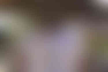 Two men smiling, wearing white shirts at 7th Annual Golf Tournament