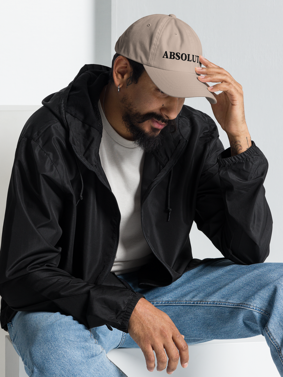 Man adjusts Absolutely dad hat