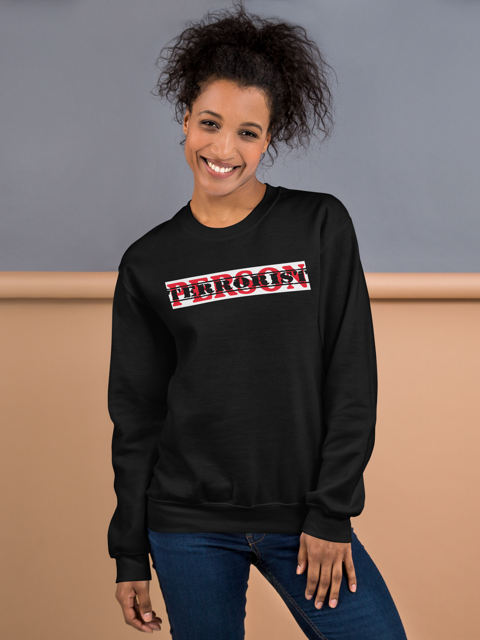 Person wearing black "PERSON" unisex sweatshirt