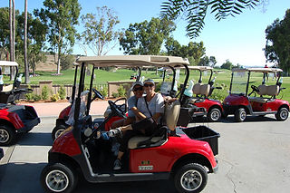 Couple in golf cart at Laguna CC