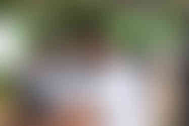 Three women smiling in golf cart at 7th Annual Golf Tournament