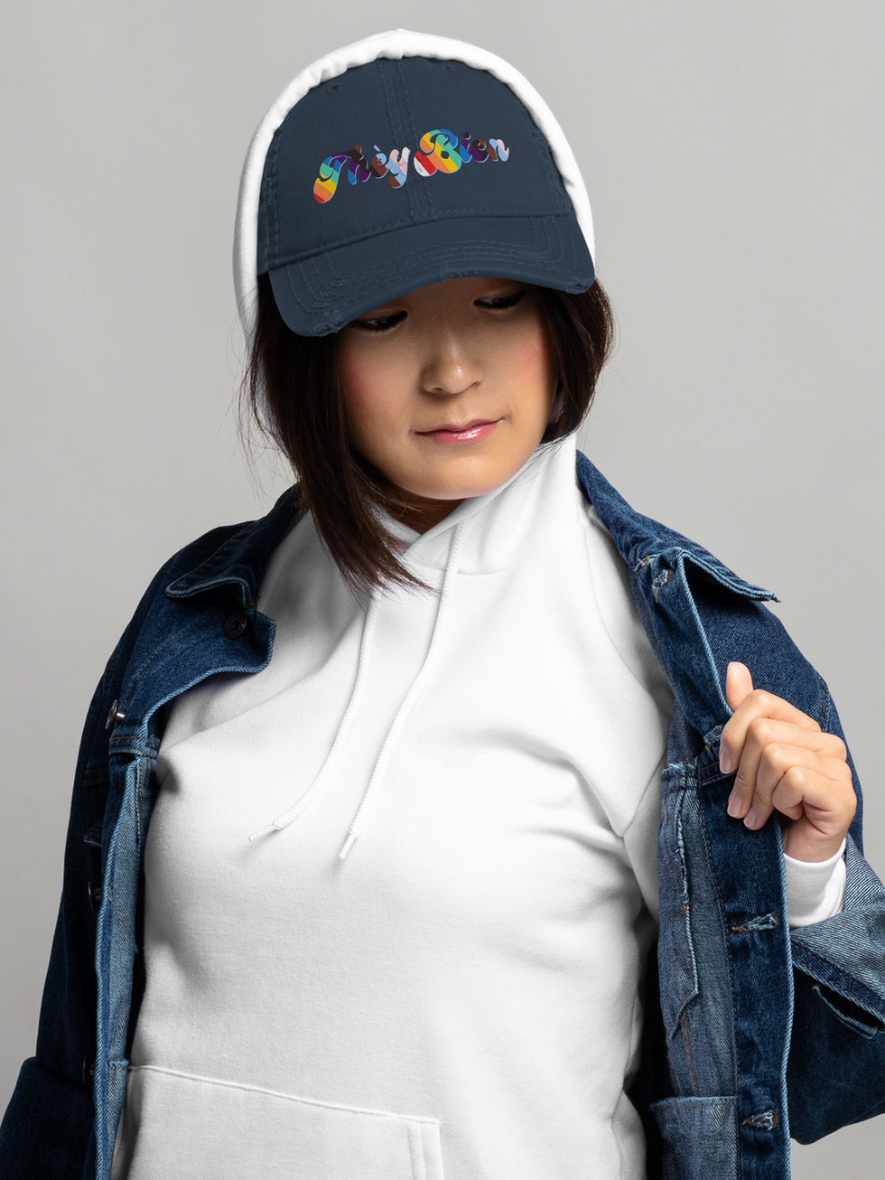 Woman wearing navy They Bien distressed dad hat