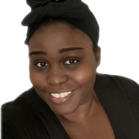 Smiling woman with braided bun in black top