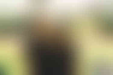 Two women smiling, wearing sunglasses and Canyon Club shirts