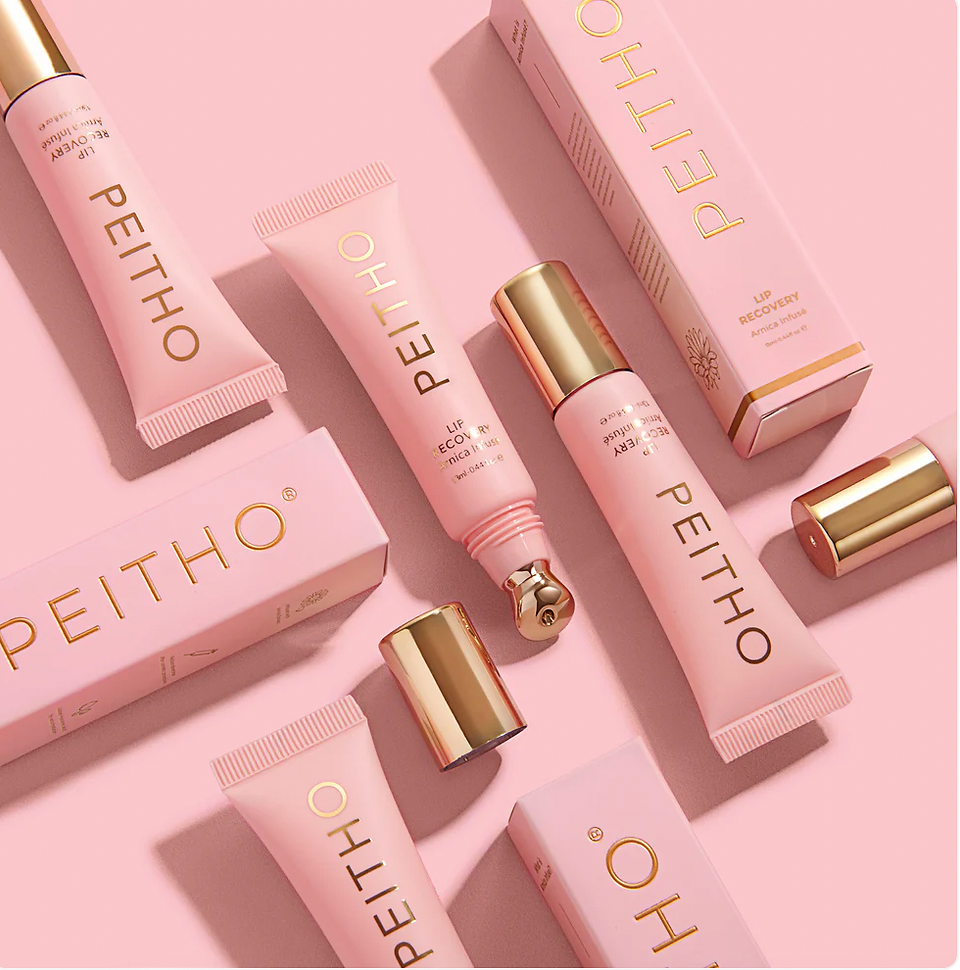Peitho lip balms in a flat lay with their packaging