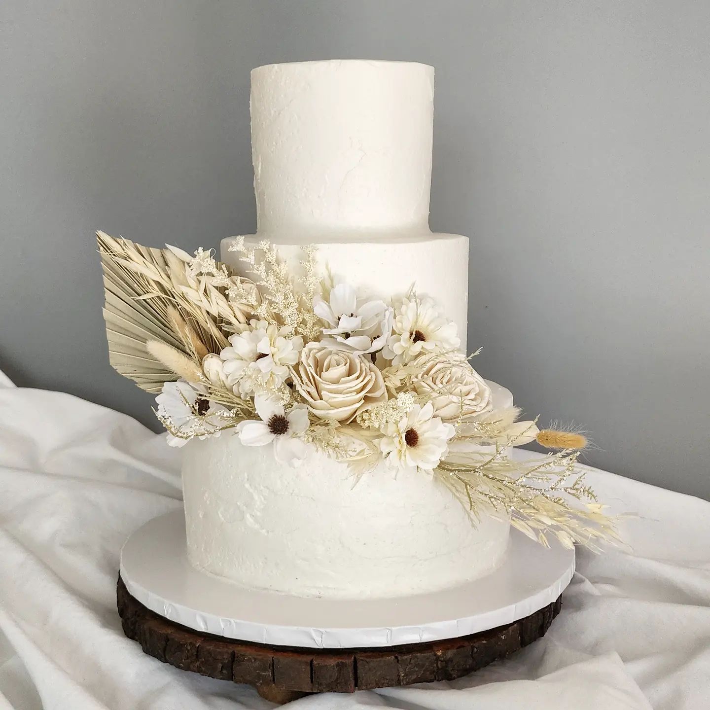 buttercream wedding cake with dried flowers