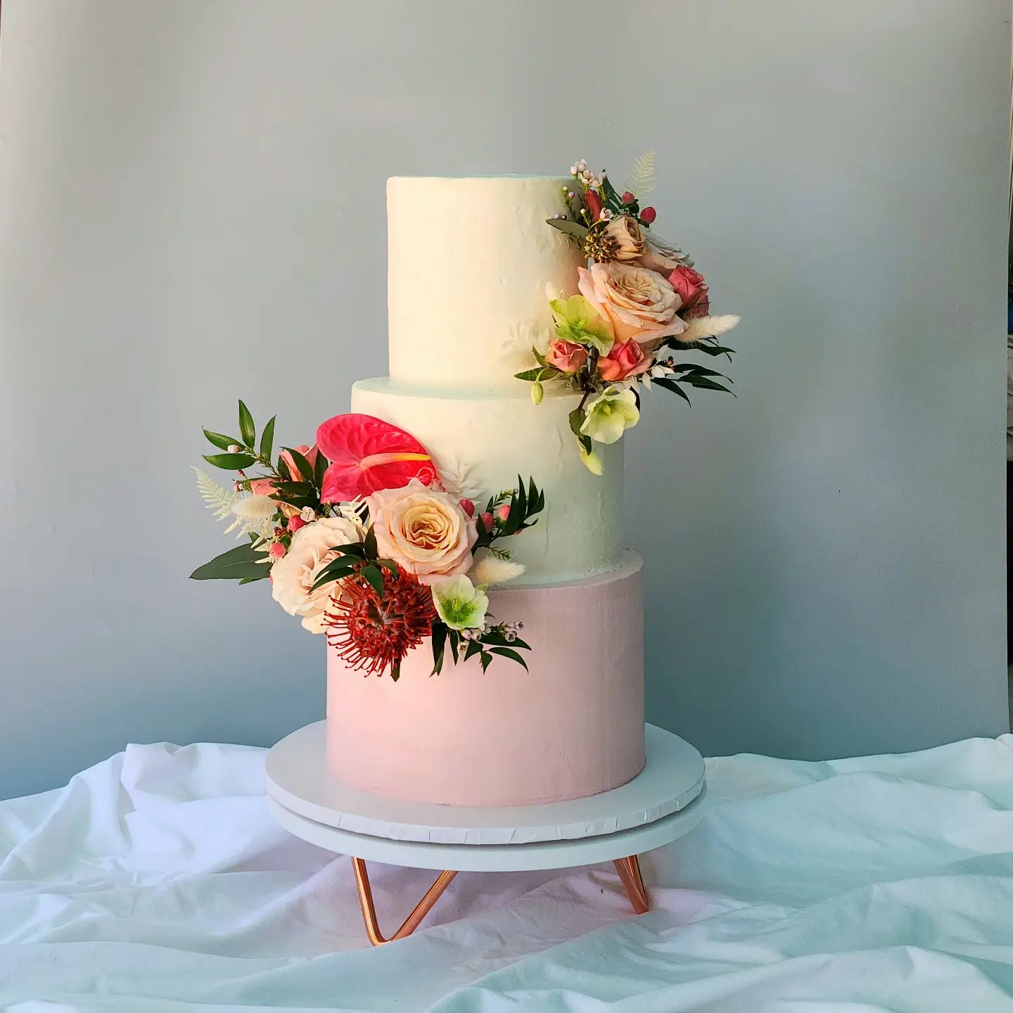 buttercream wedding cake with fresh flowers