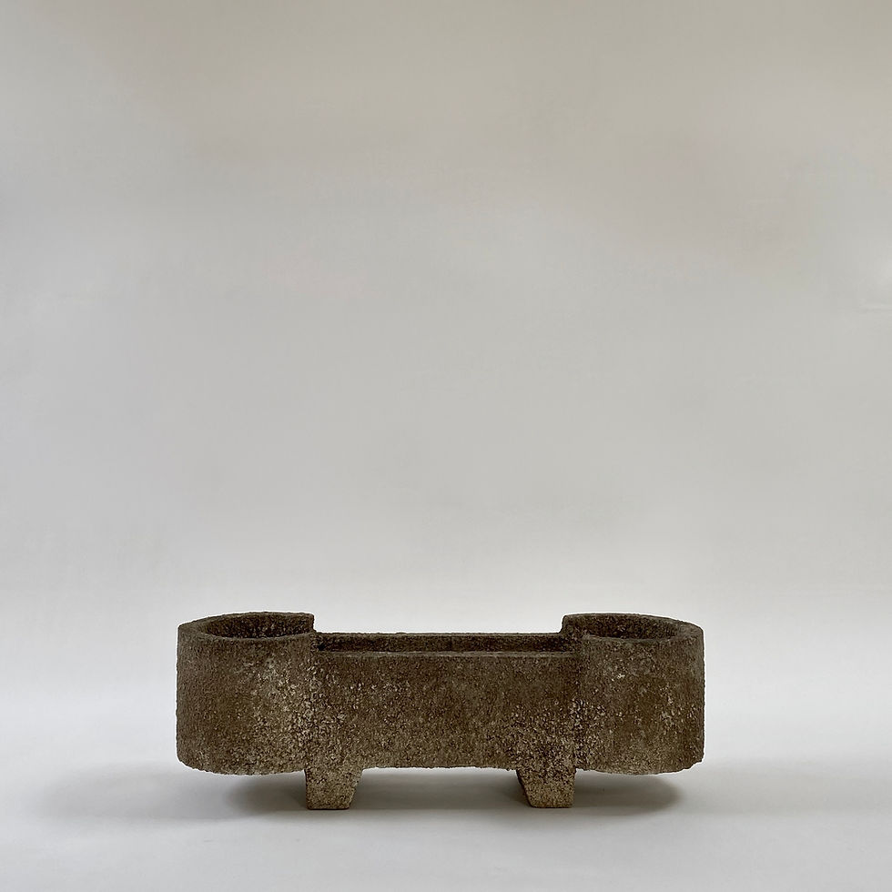 Swiss mid-century footed concrete planter in brutalist style, made from rough textured concrete.