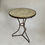 Thumbnail: Antique French bistro table with banded marble top and well-worn patina
