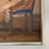 Thumbnail: Modernist painting of a female nude sitting on a blue chair
