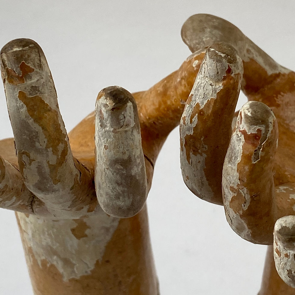 Pair of antique Santos hands with lovely worn original paint mounted to metal stand