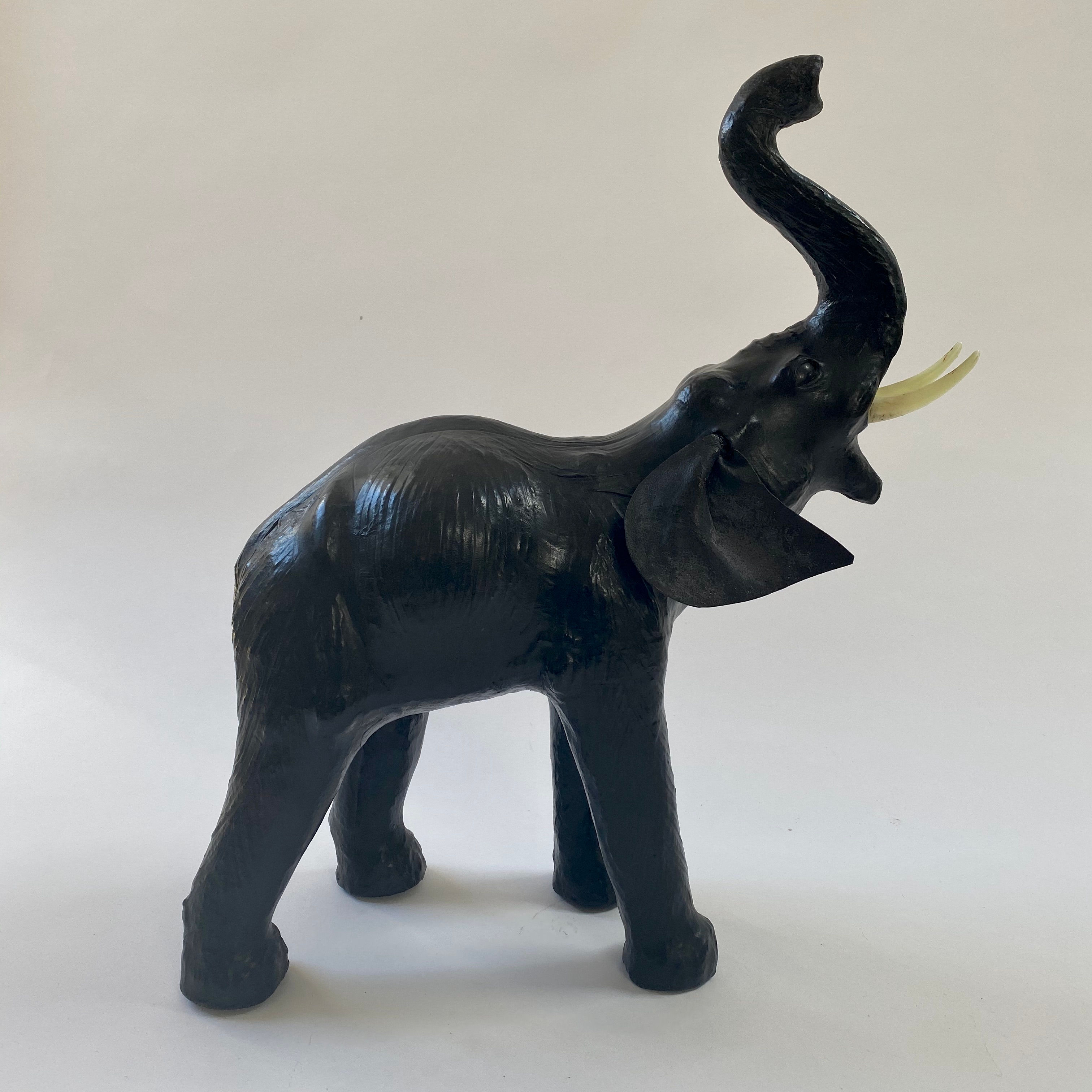 Vintage Liberty-style leather elephant with raised trunk