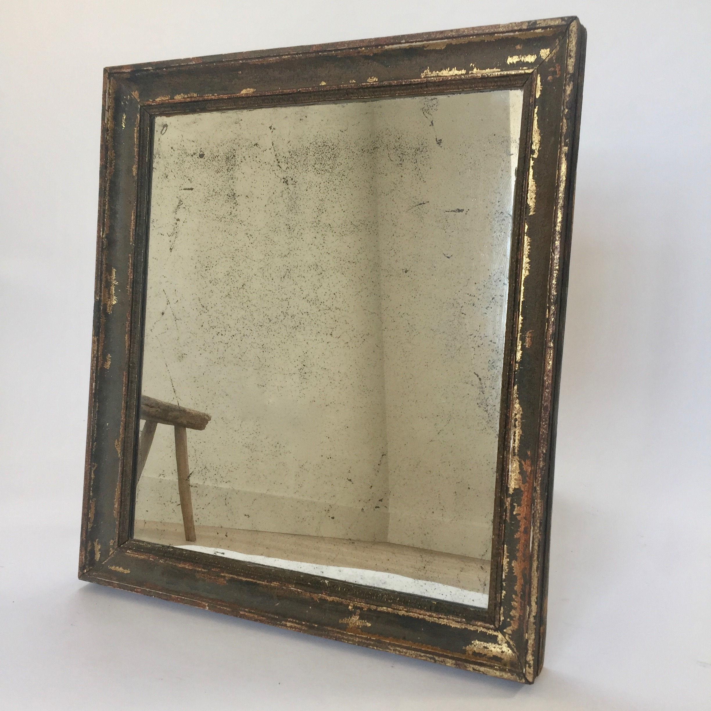 Antique French mirror with beautiful painted frame and foxed mercury plate