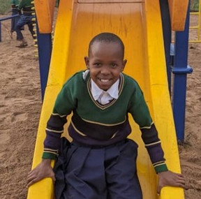 Trying out the slide at the new playground