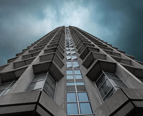 London skyscraper towering against a stormy sky
