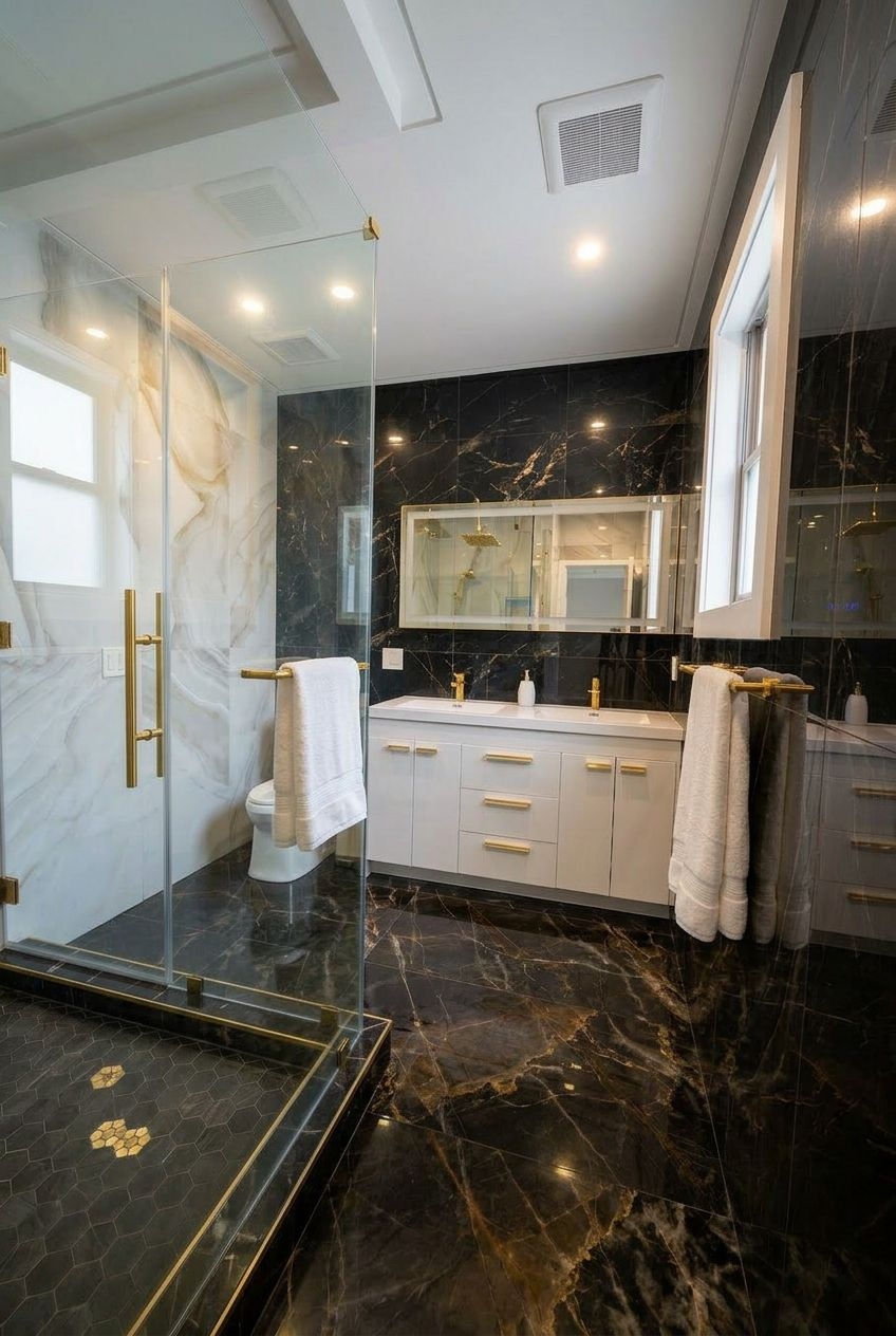 Luxurious bathroom with marble and glass shower.
