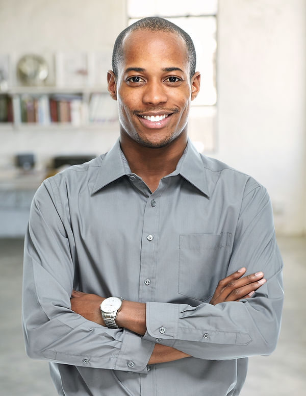Smiling businessman in grey button down shirt