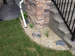 A small perennial bed next to main stairs