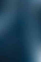 The image is the cover of a book titled "Online Gaming in Context: The social and cultural significance of online games." It is part of the "Routledge Advances in Sociology" series. The book is edited by Garry Crawford, Victoria K. Gosling, and Ben Light. The cover has a minimalist design with an abstract blue light pattern on a dark background, giving it a sleek and modern look. The cover design is simple and does not feature any specific gaming imagery, which suggests that the book takes a serious and academic approach to the subject of online gaming. It likely explores the impact of online games on society and culture, examining how they have become a significant part of contemporary social interactions and cultural expressions. The Routledge logo at the bottom right corner identifies the publisher, Routledge, known for scholarly publications across the humanities and social sciences. The book is probably aimed at students, researchers, and professionals interested in sociology, game studies, and the broader implications of gaming in today's digital society.