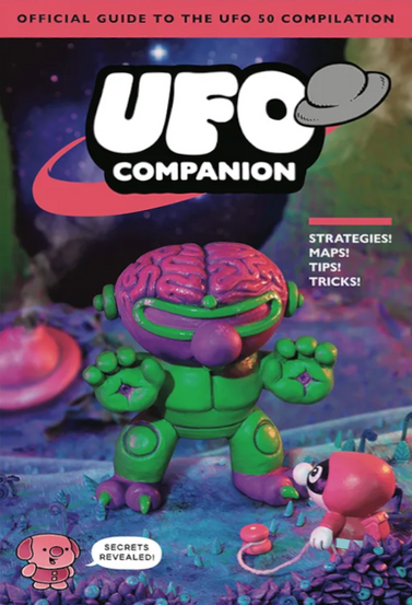Colorful game guide cover titled “UFO Companion: Official Guide to the UFO 50 Compilation,” featuring a toy-like green alien creature with an exposed pink brain and purple details standing on a surreal alien landscape, with a small pink character nearby, a space-themed background with planets and stars, bold white and black title text at the top, and side text promising strategies, maps, tips, tricks, and secrets revealed.